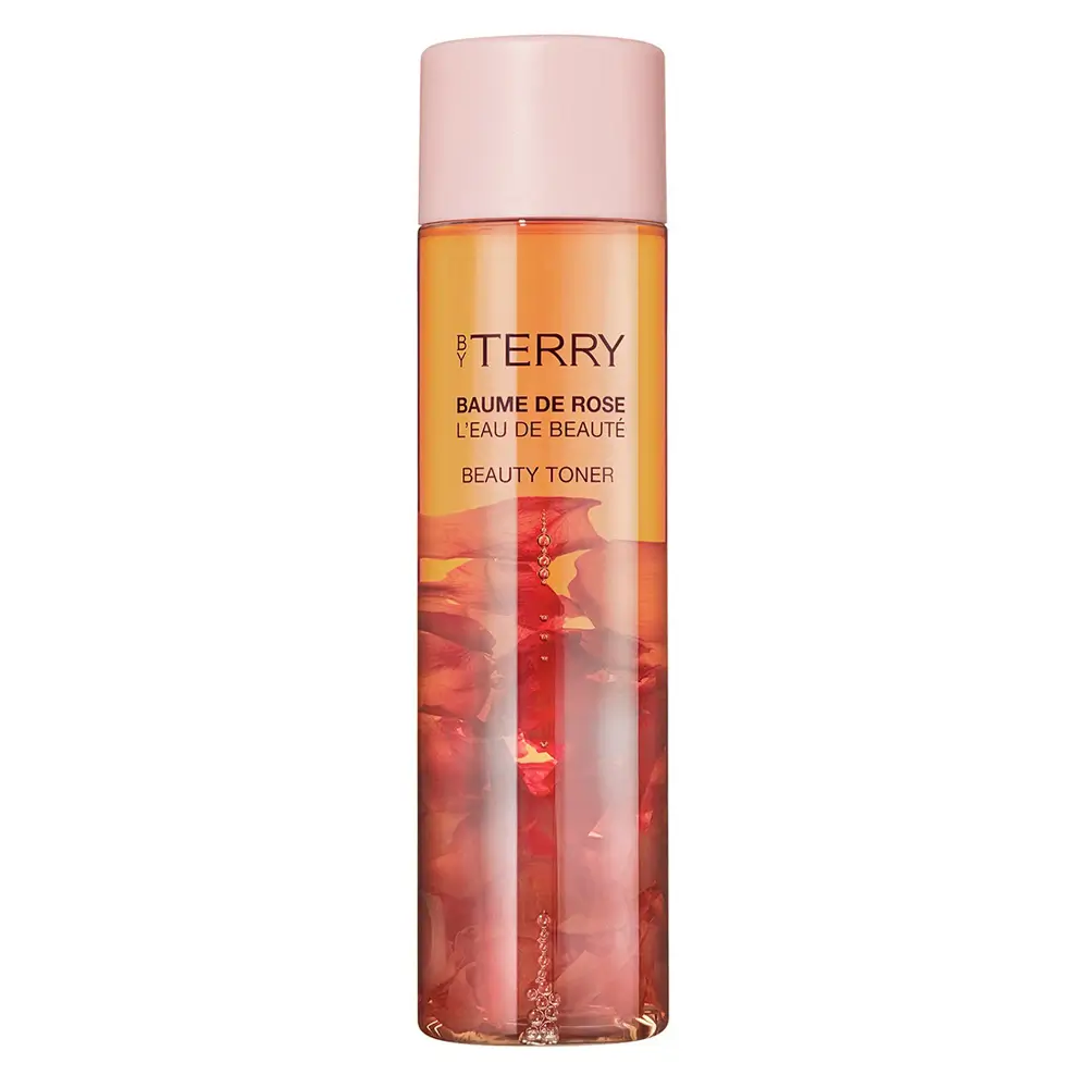 BY TERRY Baume de Rose Beauty Toner bottle with floating rose petals