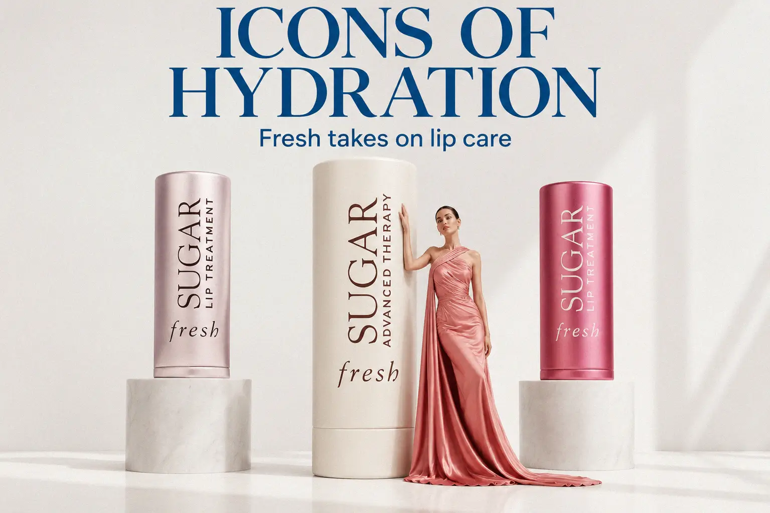 Three Fresh Sugar lip balms in white and metallic packaging arranged on a neutral surface for a clean aesthetic.